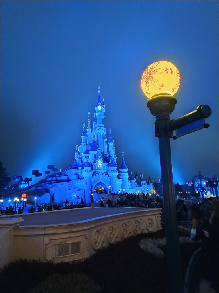 disney castle at disneyland paris at night