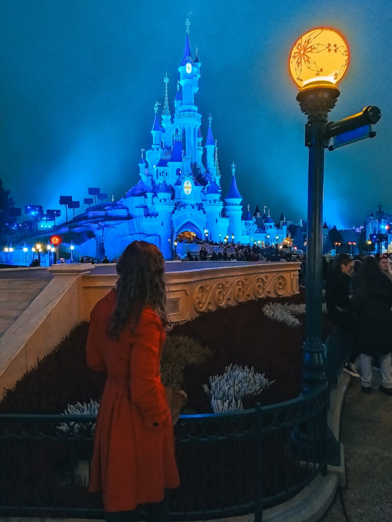 disney castle at disneyland paris at night