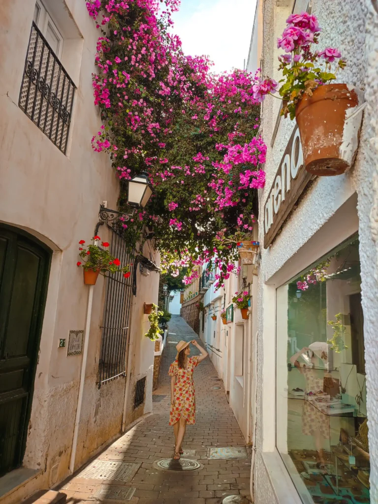 Flowers hanging over the street in Mojácar, Spain